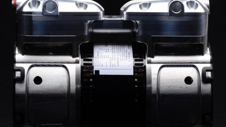 New Oil-Less Rocking Piston Compressors