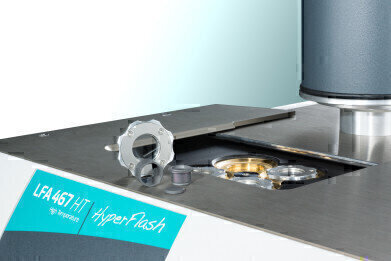 Light Flash Apparatus for Determining Thermal Diffusivity and Conductivity beyond 1250°C
