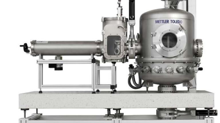 New Vacuum Mass Comparator to Support the Redefined Kilogram